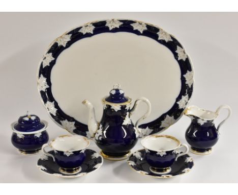 A Meissen cabaret set, comprising coffeepot and cover, cream jug, sugar bowl and cover, two teacups and saucers, oval tray en