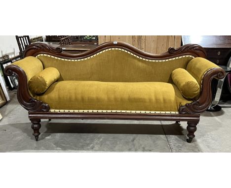 An early Victorian mahogany sofa with acanthus carved shaped back and scrolled arms. 78" long
