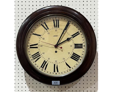 A mahogany dial clock, the enamel dial with Roman numerals and sweep seconds hand. 16" diam.