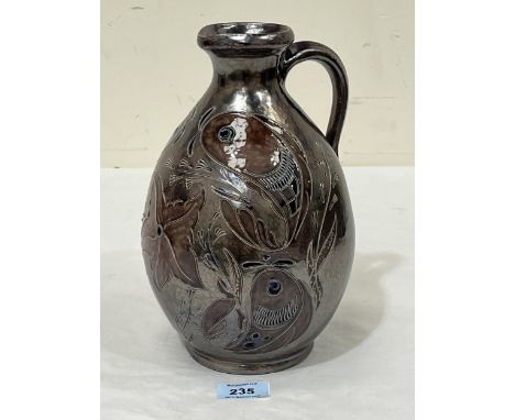 WIM MUHLENDYCK. GERMAN 1905-1986 A stoneware pitcher, sgraffito decorated with marine life on a lustrous glass. Signed. 10" h