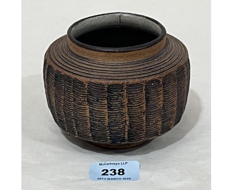 DAVID LEACH. OBE. BRITISH 1911-2005 (FOR LOWERDOWN) A stoneware ribbed low vase. c.1970-75. Impressed artist's seal. 4½" diam