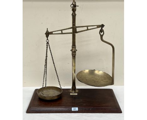 A set of Victorian brass shop weighing scales, bearing label for Young, Son &amp; Marlow. 27" high