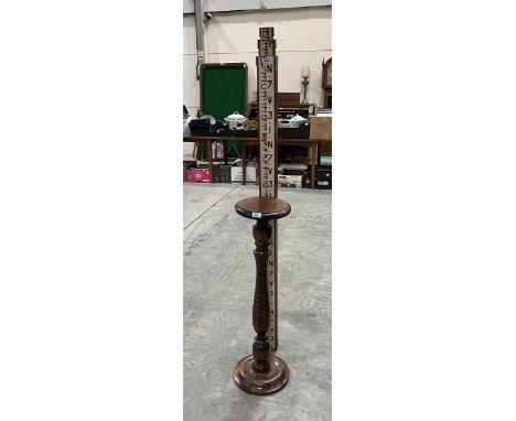 A surveyor's 14ft Staves Levelling staff and a jardiniere stand