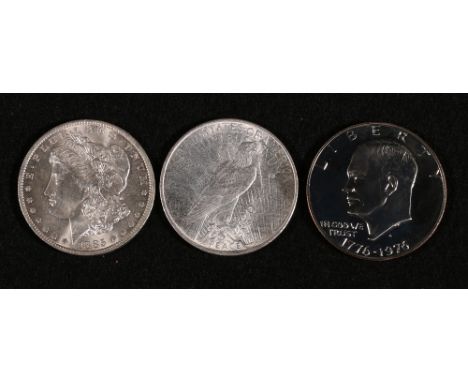 United States of America Morgan dollar 1885 O ef+, Peace dollar 1923 nef and Eisenhower dollar 1976 aunc.