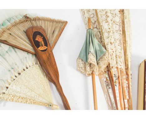 Sorrento Ware fan, carved ivory stick fan, mother of pearl inlaid fan and a miniature parasol 