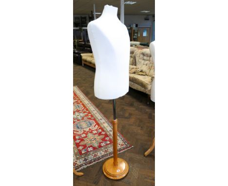 Half male shaped mannequin on light oak stand