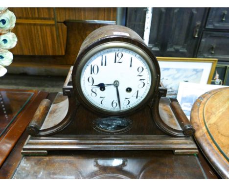 Striking mantle clock in oak Napoleon style case 