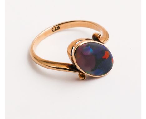 Antique 9ct gold opal doublette dress ring set with an oval doublette within a crossover design, shank stamped 9c.  Ring size