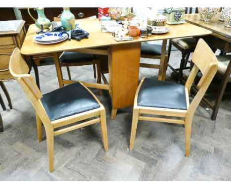 A 3' light oak G-Plan drop leaf dining table and 4 similar chairs