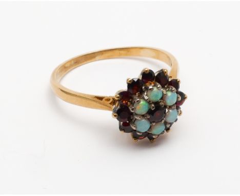 18ct gold garnet and opal cluster ring hallmarked.  Ring size S