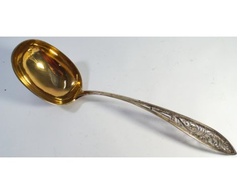Continental silver and silver gilt ladle with filigree work handle 31cm long 