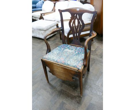 A Chippendale style mahogany commode arm chair  
