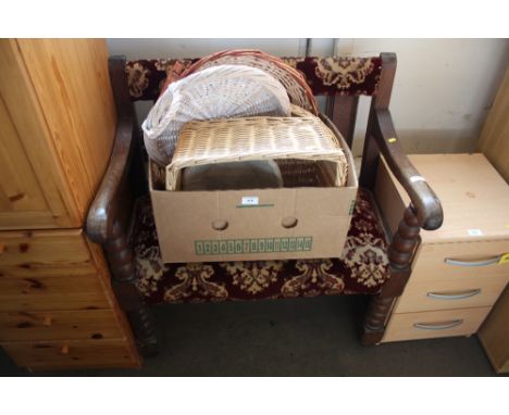 An oak and upholstered hall bench raised on turned bobbin supports
