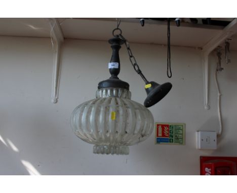 A metal and glass light fitting