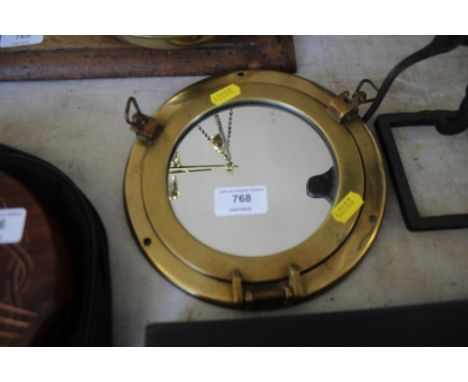 A brass framed mirror 
