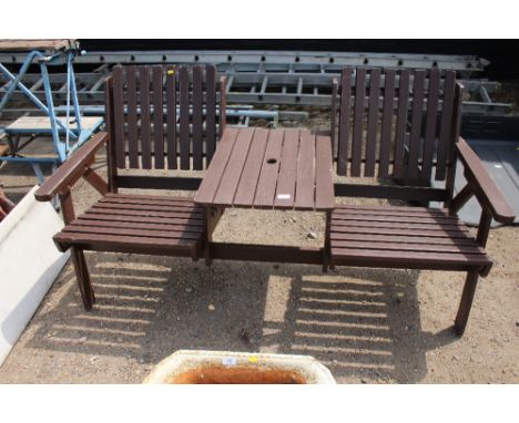 A hardwood garden bench with a fitted integral table