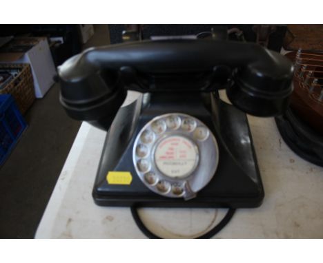 A rotary dial Bakelite telephone