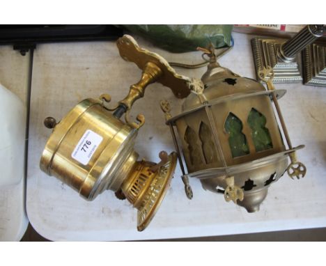 A brass wall mounting light together with an Eastern brass hanging light 