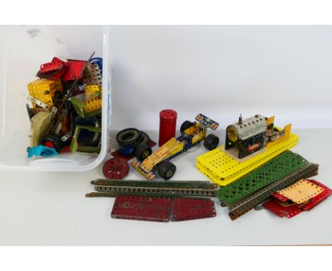 Meccano - A large quantity of vintage and modern Meccano parts and part built items. Lot includes a partially constructed rac