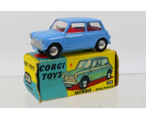 Corgi - A boxed Morris Mini Minor in light blue # 226. The car appears in Very Good condition with signs of light use in a Go