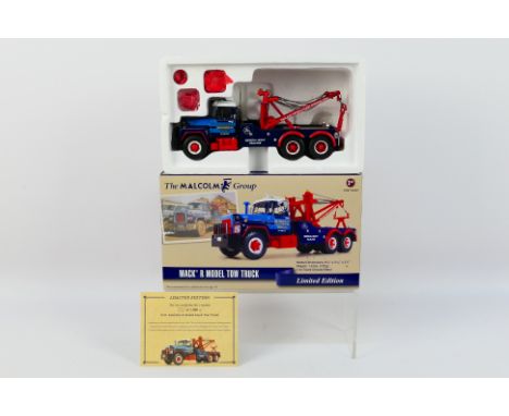 First Gear - A boxed Limited Edition 1:34 scale 'The Malcolm Group' Mack R Model Tow Truck by First Gear. The model numbered 