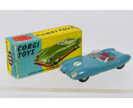 Corgi - A boxed Lotus Mark Eleven Le Mans Racing Car in light blue # 151. The car appears in Very Good condition with some we