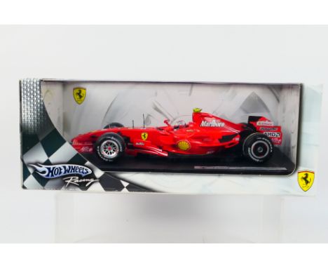 Hot Wheels Racing - A boxed 1:18 scale Ferrari F2007 Kimi Raikkonen car # K6629. The model appears Mint in a Good box with li