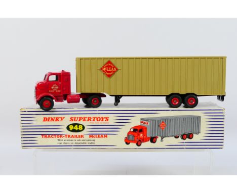 Dinky - A boxed GMC Cabover tractor trailer in McLean livery # 948. The model appears in Very Good condition overall with som
