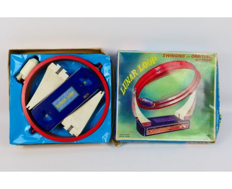 Daiya - A boxed vintage Daiya battery operated 'Lunar Loop'. The Japanese made toy has some age and play wear appearing to be