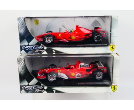 Hot Wheels Racing - 2 x boxed 1:18 scale Ferrari F1 cars, a Michael Schumacher 248 F1. # J2980 and a Felipe Massa F2007 car #