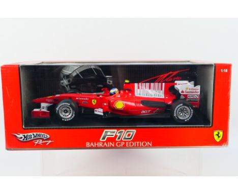 Hot Wheels Racing - A boxed 1:18 scale Ferrari F10 Bahrain GP Edition Fernando Alonso car # T6287. The model appears Mint in 