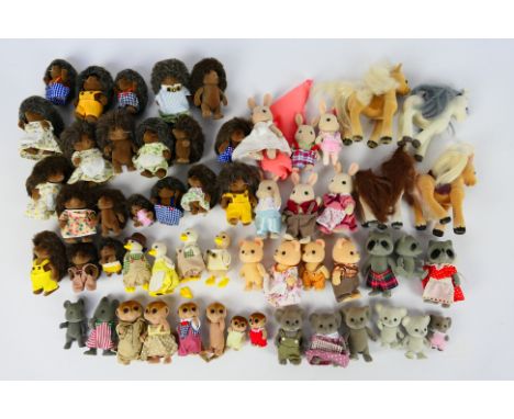 Sylvanian Families - An unboxed collection of over 50 vintage Sylvanian Families animal figures. Lot includes Sylvanian Famil