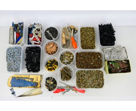 Meccano - A large quantity of vintage and modern Meccano parts. Lot includes several plastic  tubs of items including screws,