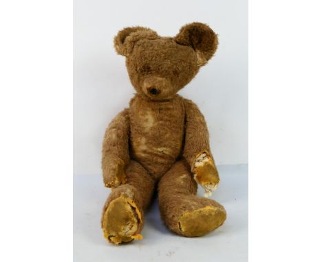 Steiff - A large 32" tall jointed straw filled bear. He is believed to be Steiff but has no tag or button. His pads have worn