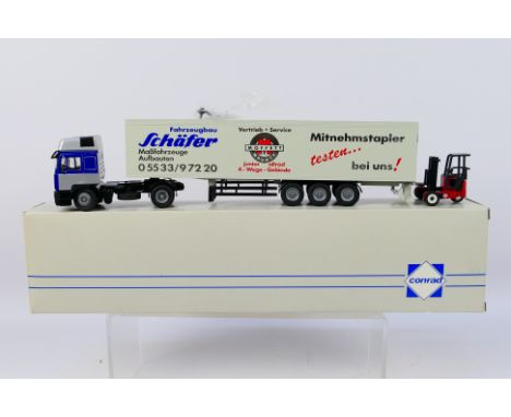 Conrad - A boxed Conrad #6107/03 MAN-E 2000 4x2 semi-trailer with Schaefer forklift. Model appears to be in Mint condition wi
