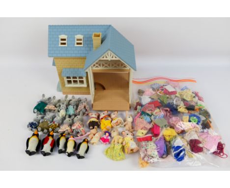 Sylvanian Families - An unboxed Sylvanian Families house with a collection of unboxed vintage Sylvanian Families animal figur