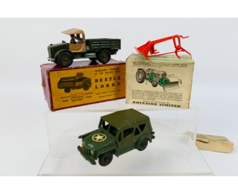 Britains - A boxed Beetle Lorry # 1877, an unboxed Austin Champ # 9760 and a boxed Muledozer tractor attachment # 9535. They 