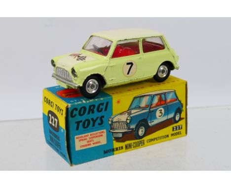 Corgi - A boxed Morris Mini Cooper Competition Model in yellow with white roof and bonnet # 227. The car appears in Good cond