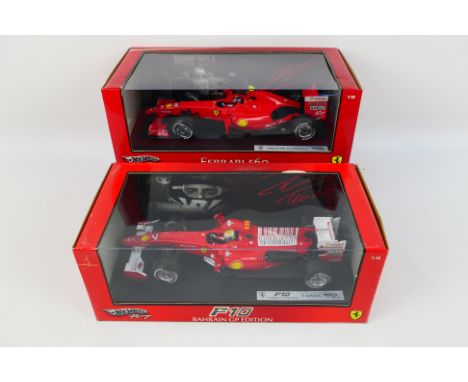 Hot Wheels Racing - 2 x boxed 1:18 scale Ferrari F1 cars, a Kimi Raikkonen  F60. # P9965 and a Felipe Massa F10 Bahrain GP Ed