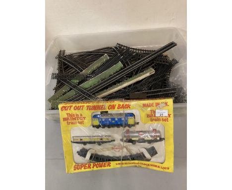 A Brimtoy clockwork train set, boxed, together with a quantity of Double O track and points.