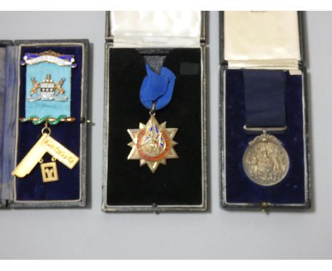 A silver and enamel jewel for Lister Lodge, a silver jewel for service to club and a medal, all cased. 