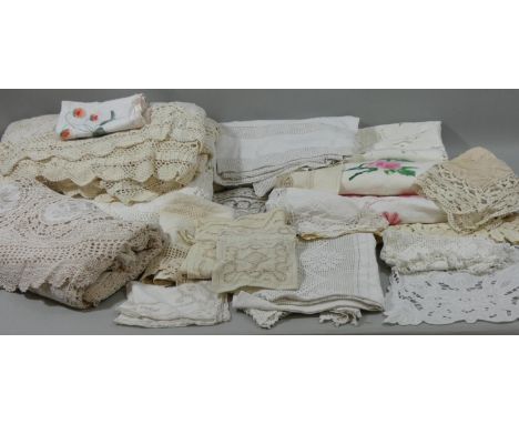 A hand crocheted single bed spread, a quantity of table cloths, bedsheets and line. 