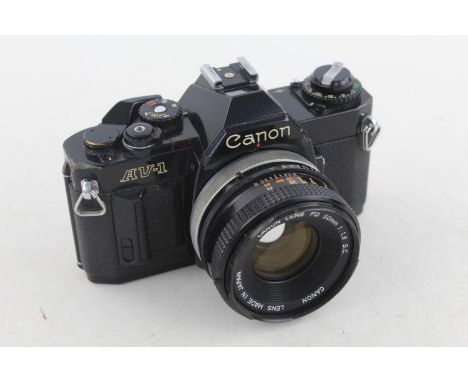 Canon AV-1 35mm SLR Film Camera w/ Canon FD 50mm F/1.8 S.C. Lens  Sold for SPARES / REPAIRS Please see photographs 