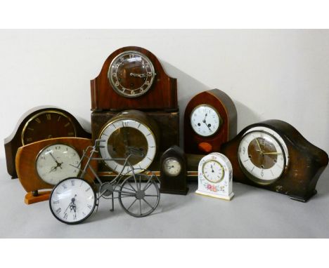 An oak cased 'Napoleon Hat' style mantle clock, together with other oak and mahogany cased mantle clocks. 