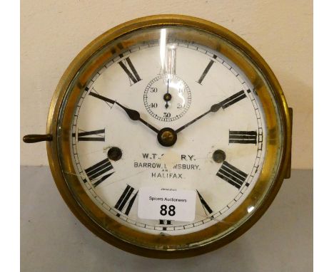 A Seth Thomas, USA two train brass bulk head clock with white enamel 6 inch dial with subsidiary seconds dial. 