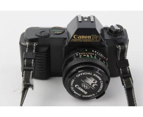 Canon T50 SLR Film Camera w/ Canon FD 50mm F/1.8 Lens  The camera is WORKING and in a vintage condition Winds and fires as sh