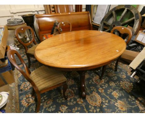 A Victorian oval mahogany tilt top dining table, raised on a tripod base, 140 x 104 cm, together with a set of four mahogany 