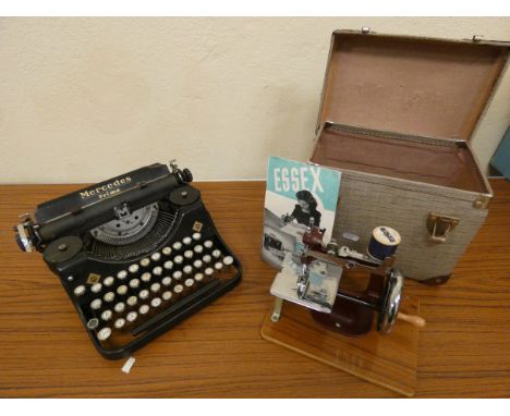 An early Mercedes Prima typewriter and a cased miniature Essex sewing machine. (2)