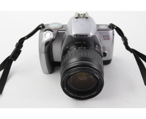 Canon EOS 300V SLR Film Camera w/ Canon EF 28-105mm F/4-5.6 Lens  This camera is WORKING &amp; in vintage condition Tested wi