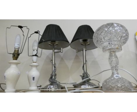 A cut glass table lamp together with two alabaster table lamps and a pair of stainless steel table lamps. (5) 